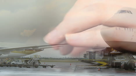 avión volando en el aeropuerto contra una persona escribiendo en el teclado