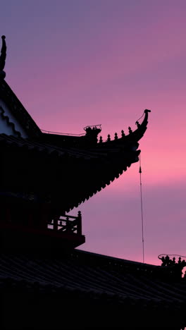 silhouette of a temple roof at sunset