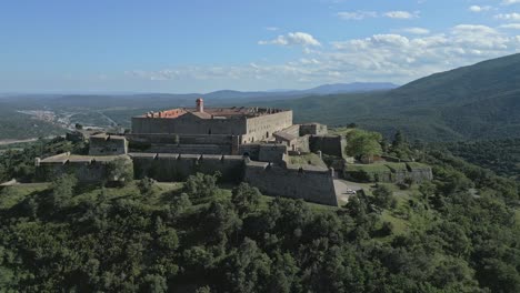 establishing aerial of fort de bellegarde pyrenees green mountain landscape