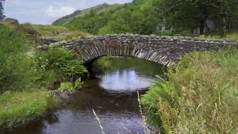 watendlath's attractive stone, packhorse bridge sitting over the watendlath beck, this is the source for lodore falls – a tourist attraction from victorian times