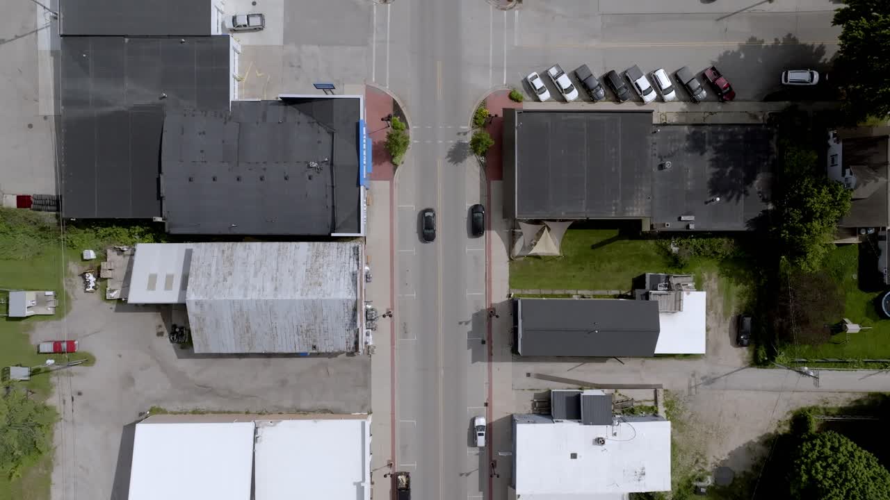 New Era, Michigan downtown with drone video overhead moving forward.