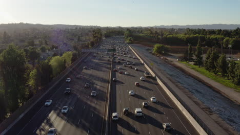 rising up above the san fernando valley freeway overlooking rush hour