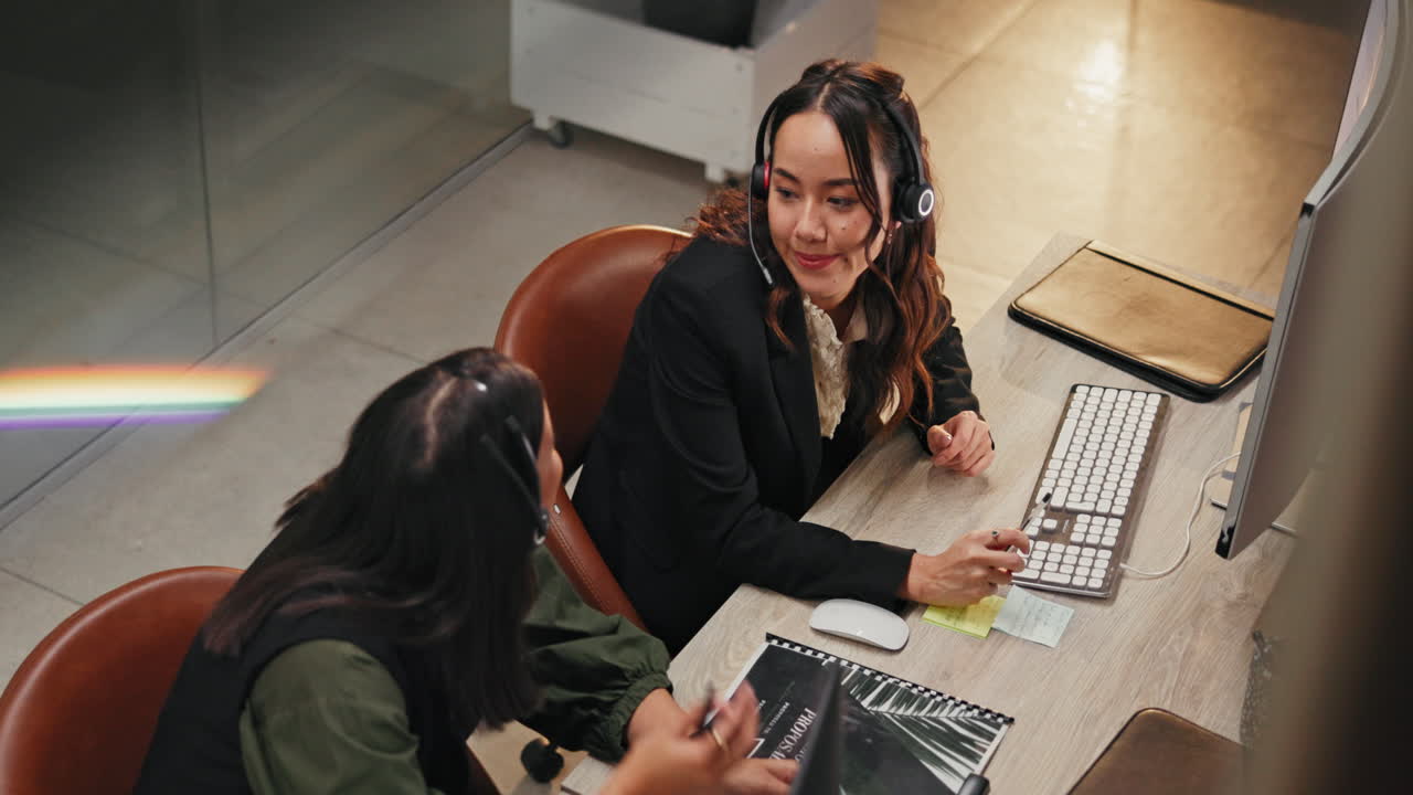Two Business Women Working Together at the Office