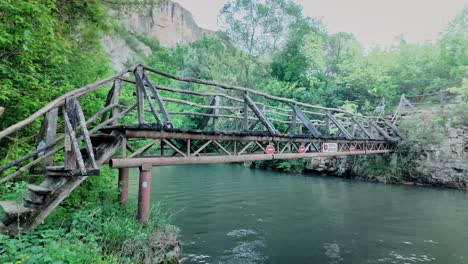 Bridge-of-kisses,-rustic-wooden-river-crossing-eco-trail-Zlatna-Panega