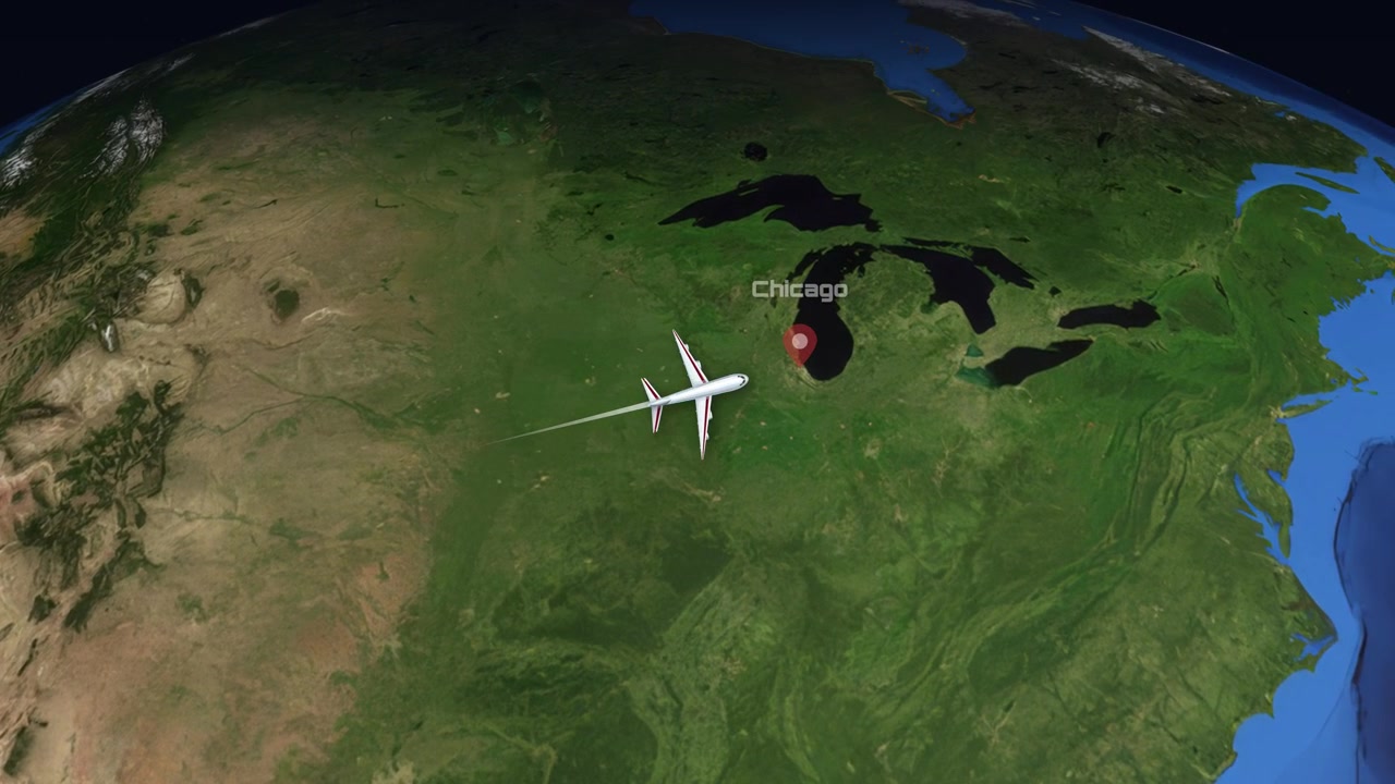 Satellite view animation follows a commercial airplane flying from Phoenix to Chicago over land