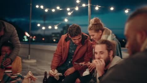 happy-group-of-friends-enjoying-rooftop-party-celebration-drinking-alcohol-making-toast-having-fun-social-gathering-celebrating-friendship-at-night