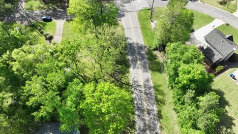 aerial 4k top-down following road with traveling cars