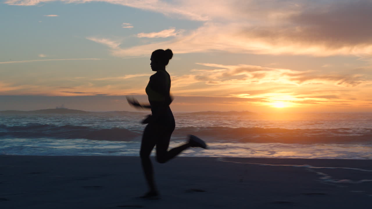 Fast, fit and active jogger running by the ocean