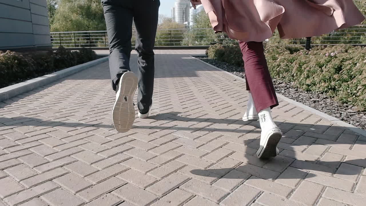 Couple walking down a brick path