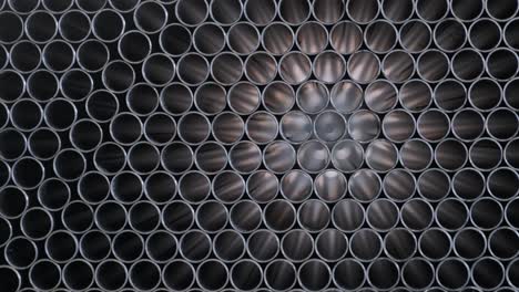 abstract background of steel pipes stacked on a pallet