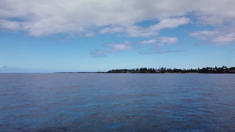 gimbal wide panning pov shot from a moving boat approaching kailua-kona on the big island of hawai'i