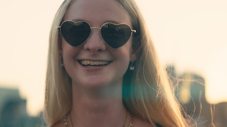 A woman wearing jewelry and sunglasses