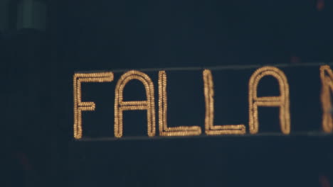 night banner on fallas festival with smoke and sparks from fire spain