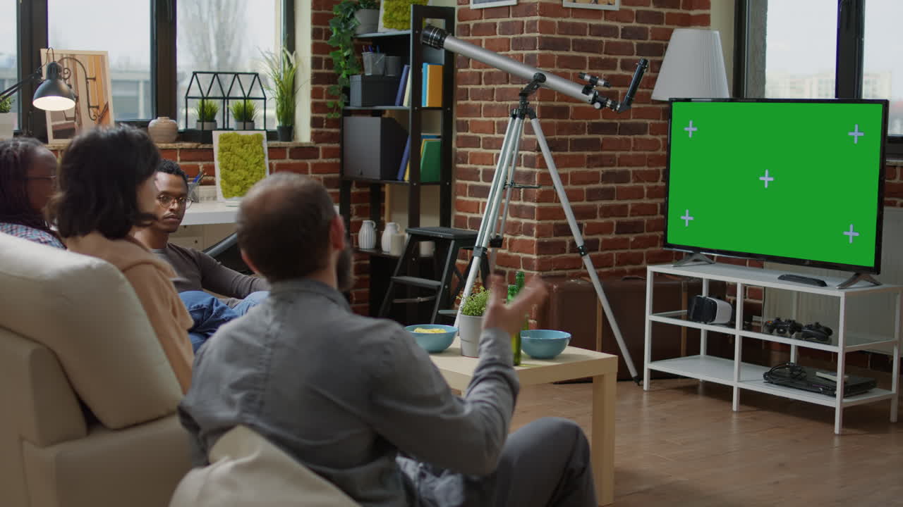 Young people using green screen technology on television