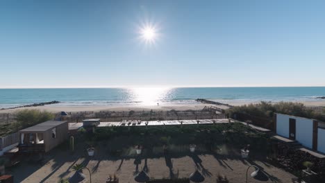 Aerial-shot-of-the-big-villa's-terrace-with-a-view-of-the-mediterranean-sea-and-the-beach-in-Frontignan,-France