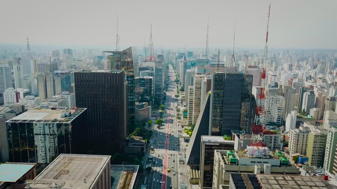 Slow descending aerial shot of bussy Avenida Paulista in S&atilde;o Paulo