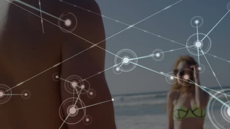 Network of connections and data processing animation over people at beach