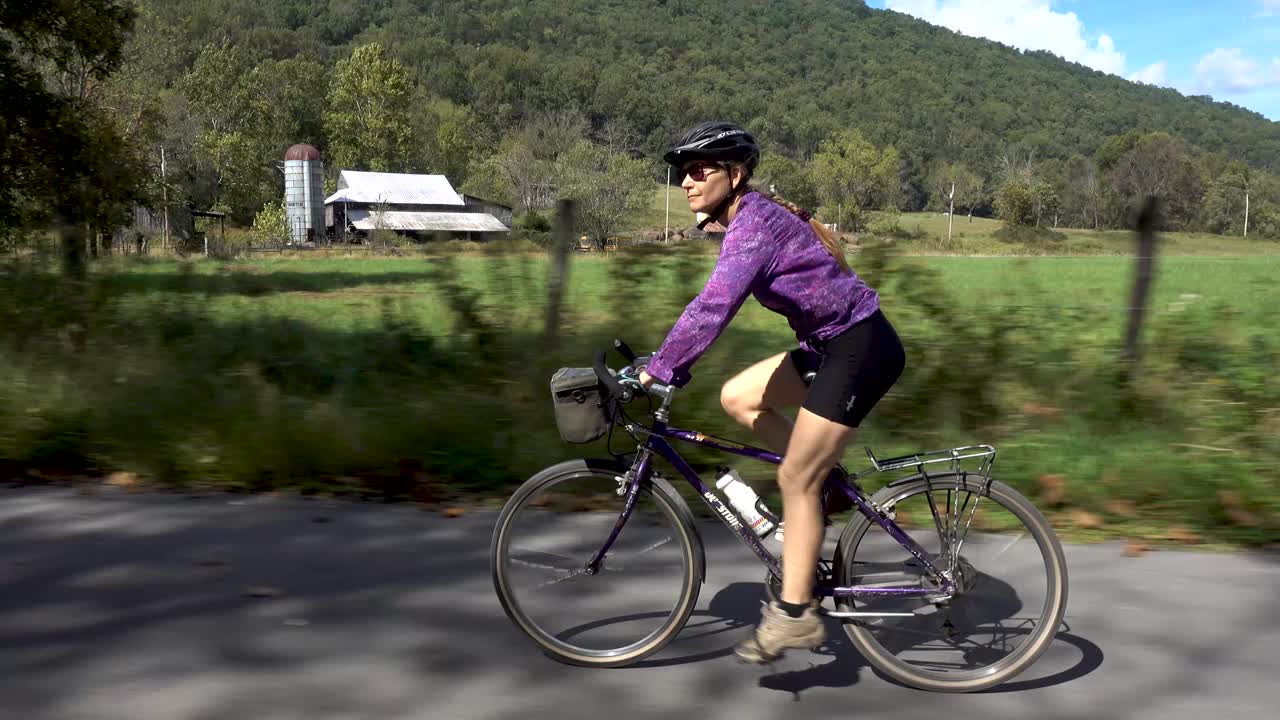 Woman Biking Through the Countryside