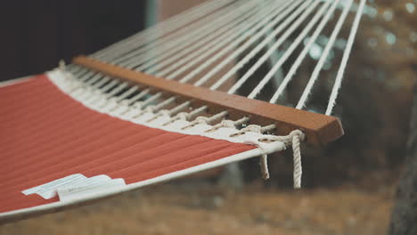 Hammock-Swaying-In-Breeze-During-Autumn-with-Colored-Leaves-on-Ground-4K-ProRes