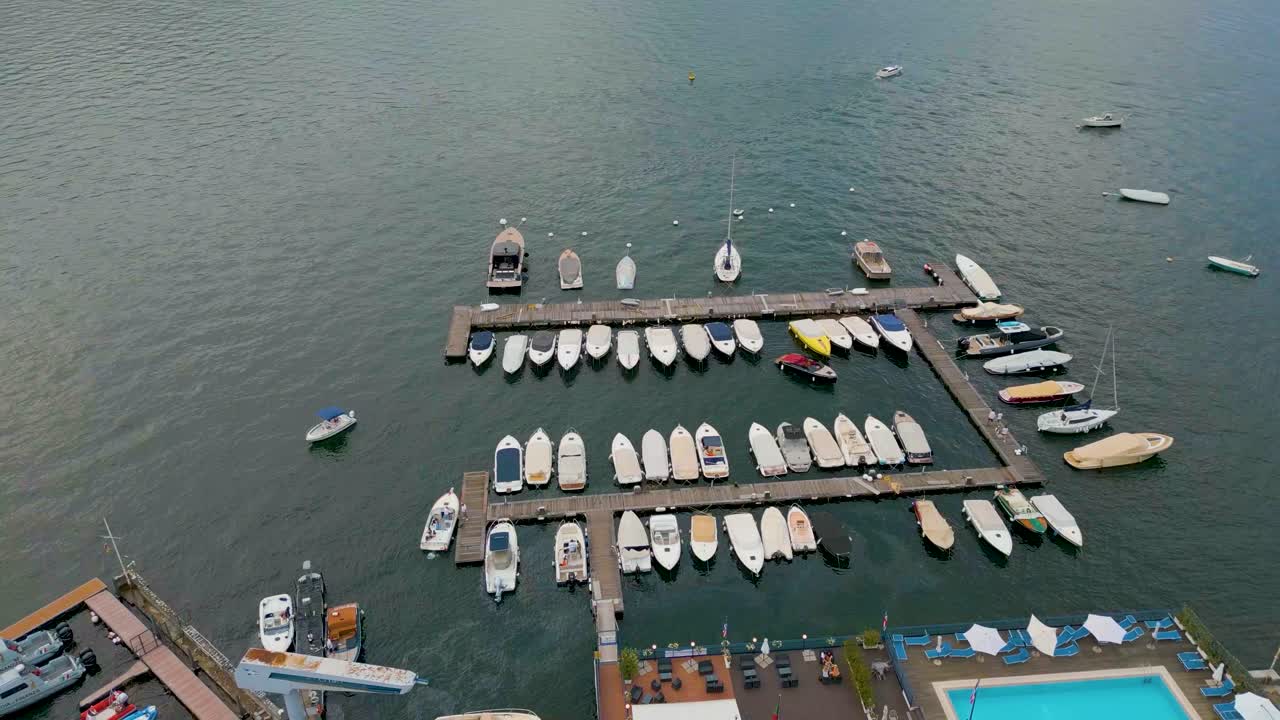 4K Aerial Drone Video of Boat Docking in the Marina on Beautiful Lake Como, Italy in the Summer