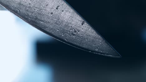 steel knife blade. close up of blade knife. steel knife edge with water dripping