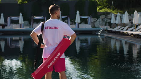 lifeguard looking around the swimming pool