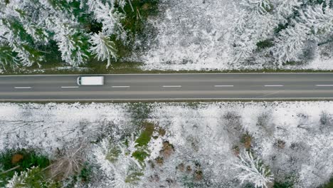 Flying-with-a-transporter-car,-filming-it-from-above