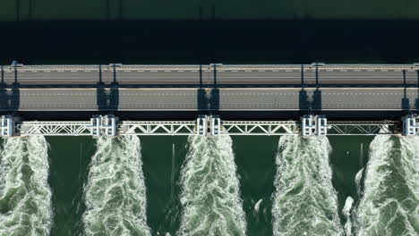 Top-View-Of-Water-Flowing-In-Slow-Motion-Through-Oosterschelde-Storm-Surge-Barrier-In-Kamperland,-Zeeland,-Netherlands