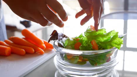 Woman-preparing-salad-in-kitchen-at-home-4k