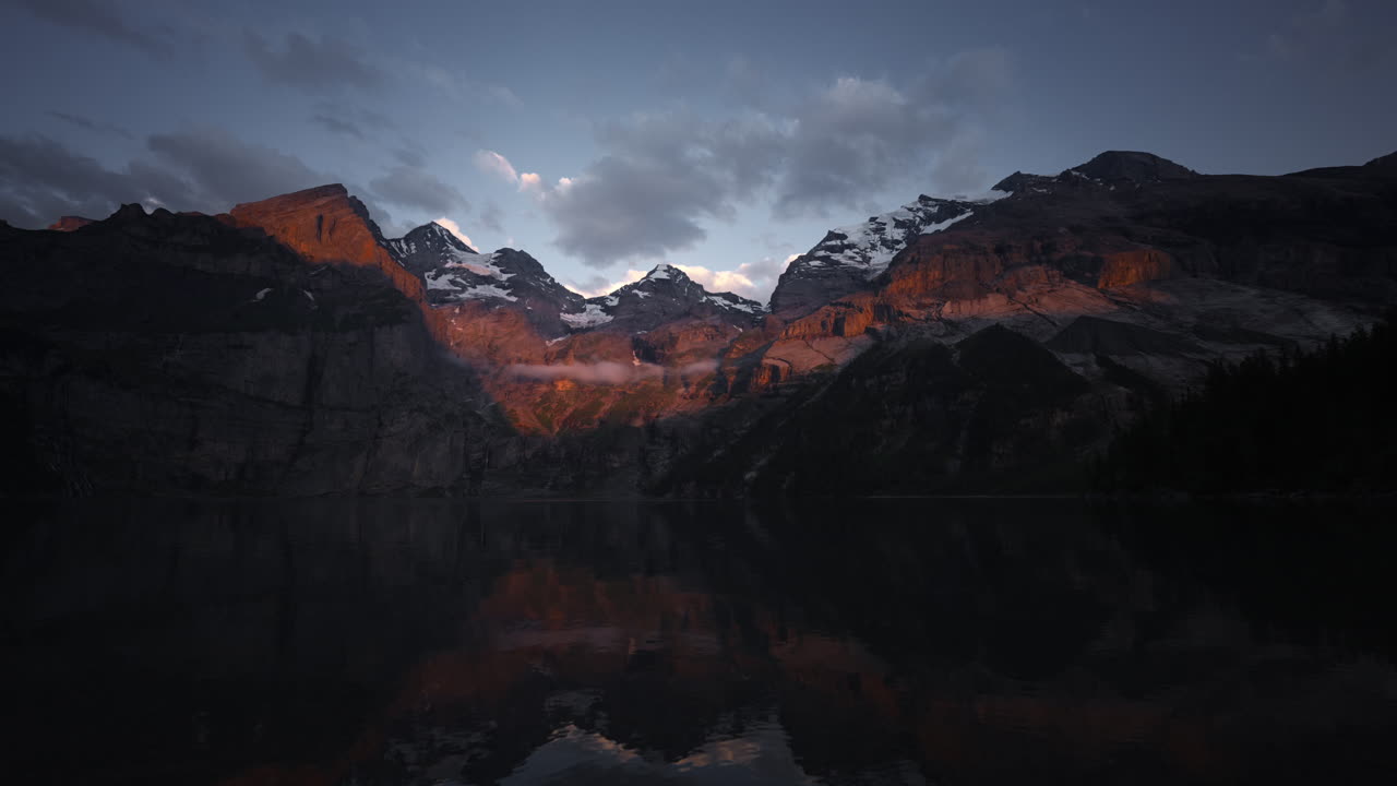 Sunrise/Sunset over Swiss Alps and Alpine Lake