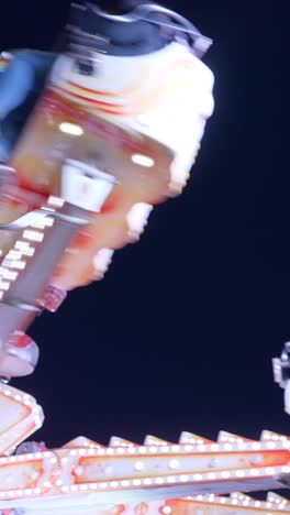 thrilling carnival ride at night with motion blur