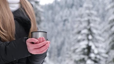 girl drinking tea in the winter forest an amazing place with a beautiful snowcovered forest beautiful girl drinking tea in the winter forest an amazing place with a beautiful snowcovered forest in the ukrainian carpathians