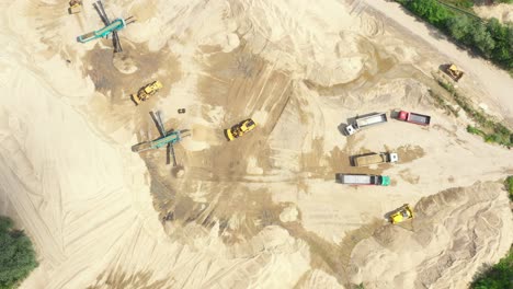 aerial view loading bulldozer in open air quarry