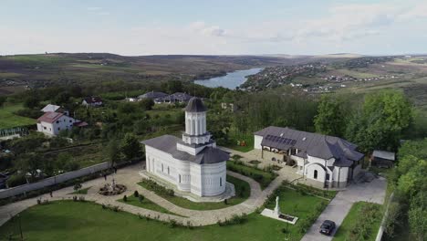 orbiting aerial of saint nicholas church, biserica sfantul nicolae, orthodox church in aroneanu, romania