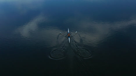 guy in his canoe rowing in the middle of danube river in vukovar croatia