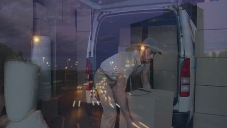 animation of road traffic over delivery man loading boxes onto van in shipping centre