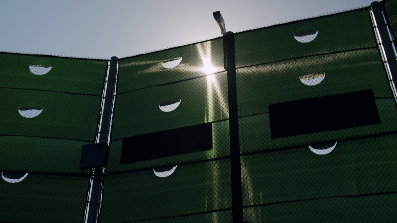 Fence with sun and sky