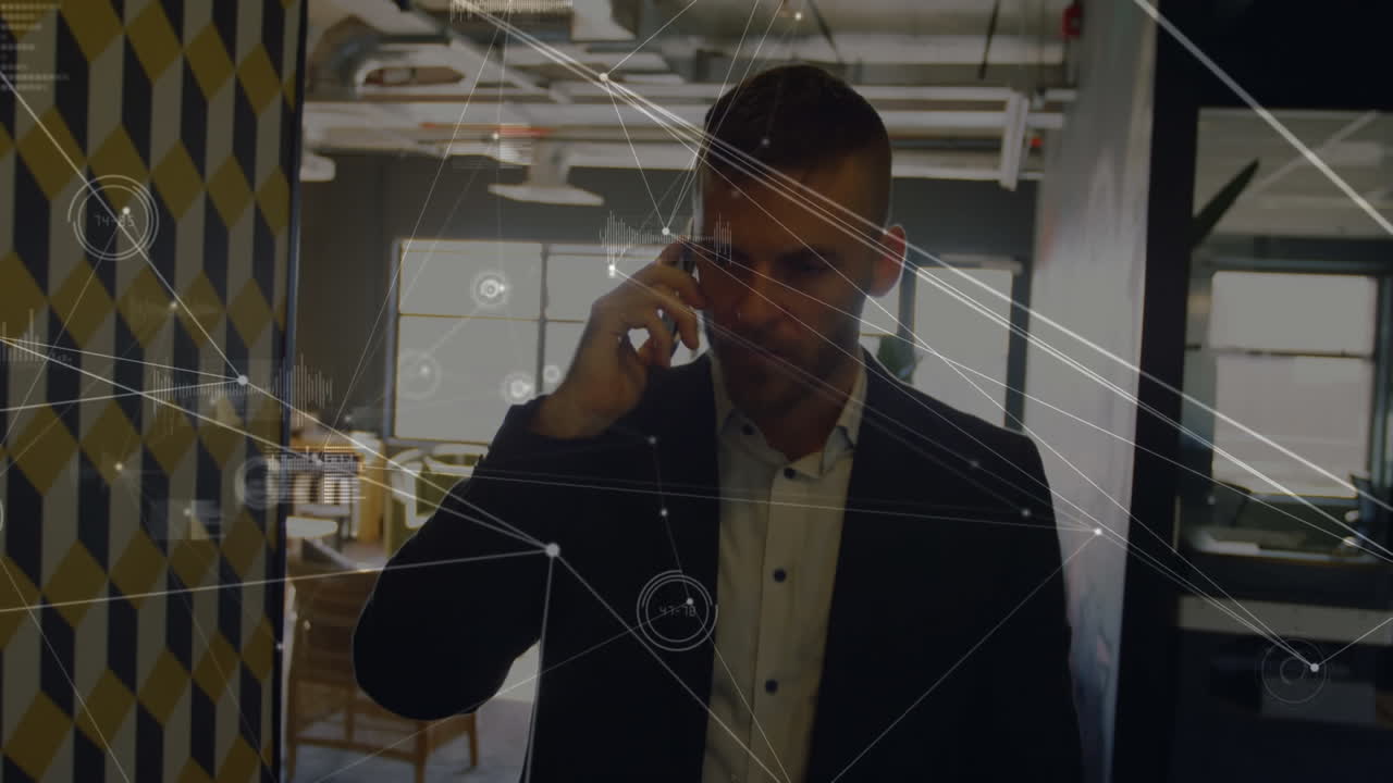 Animation of network of connections over caucasian businessman talking on smartphone at office