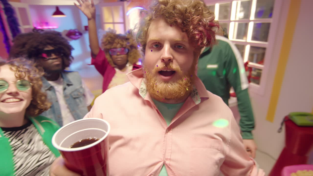 Group of friends partying in a colorful room