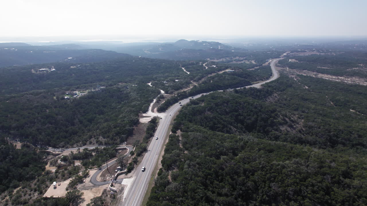 Cars driving on FM32 on Devil's Backbone outside of Canyon Lake, Texas in the Hill Country
