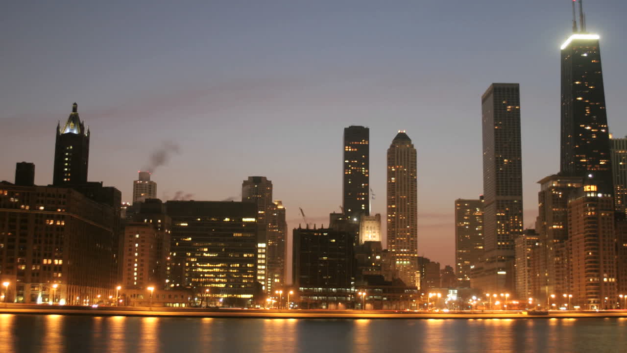 Lights brighten as the sky darkens in downtown Chicago 2
