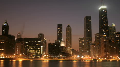lights brighten as the sky darkens in downtown chicago 2