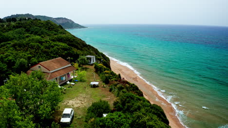 Aerial-drone-shot-over-the-long-stretching-empty-sandy-beach-in-Corfu-in-Greece