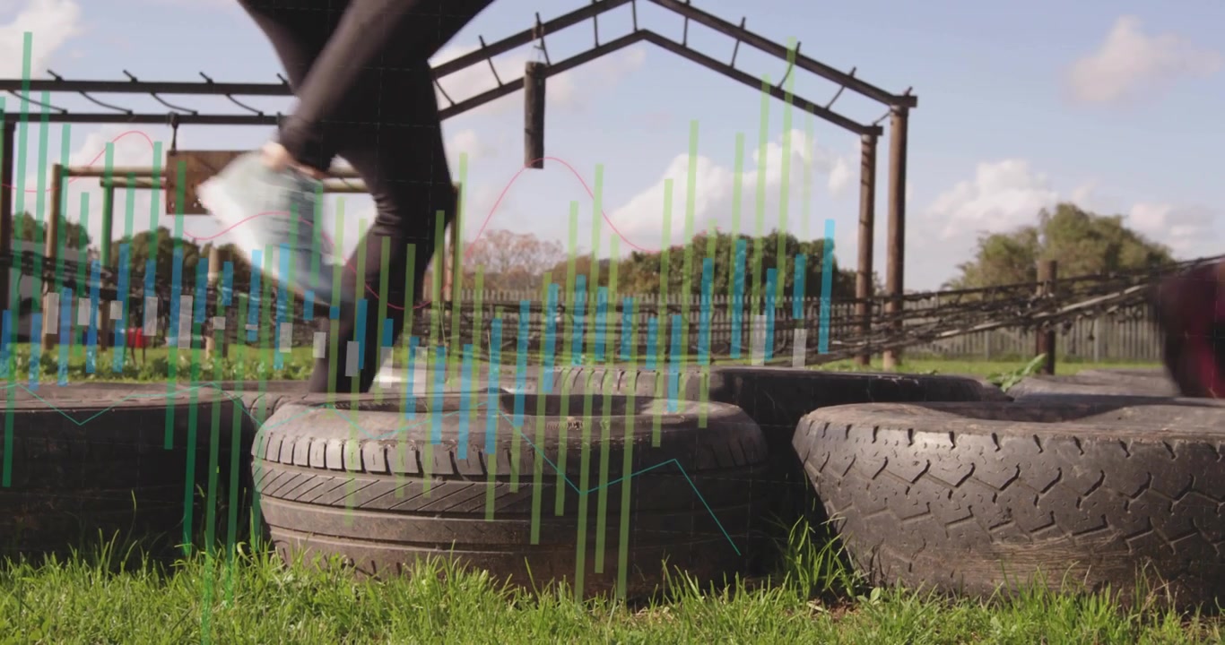 Athletes Training on Tire Obstacle Course at Outdoor Gym