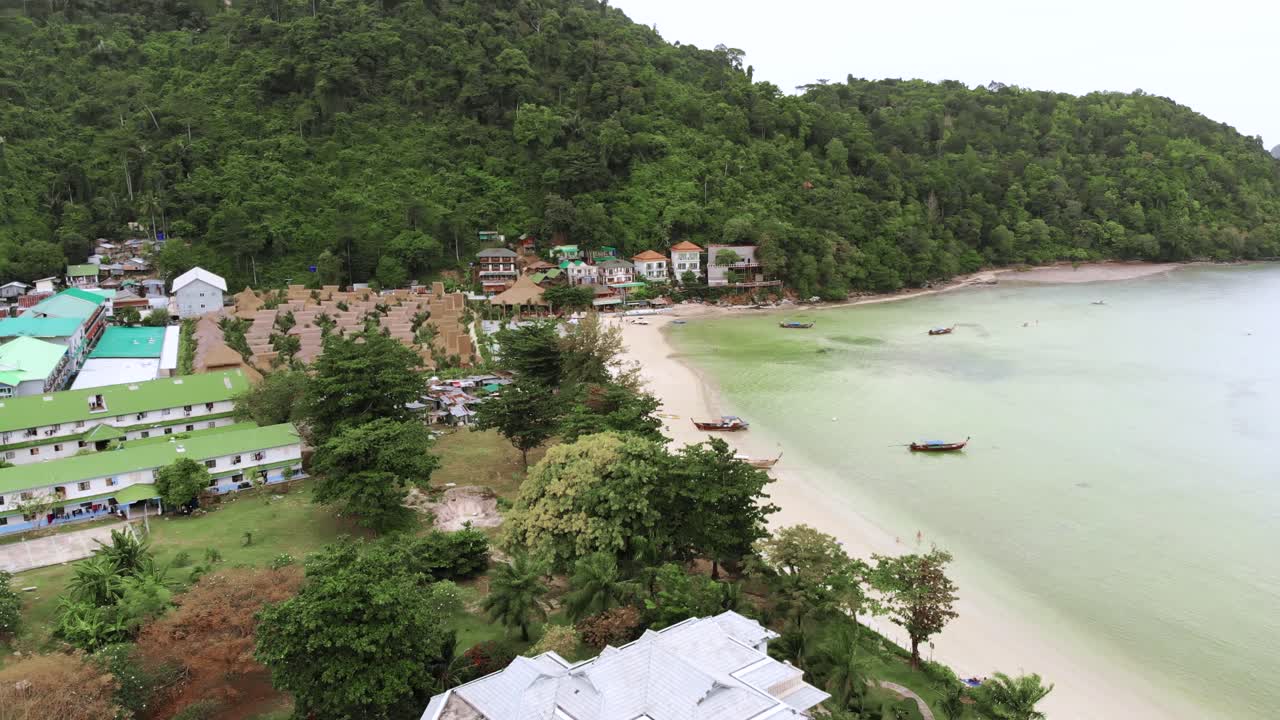 Aerial view of resorts and bars by beach. Tropical Island of Phuket