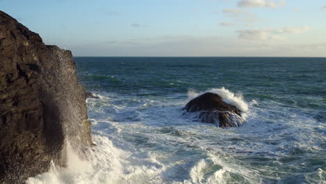 Cinematic-tracking-shot-of-a-cornish-coastline-and-rough-sea