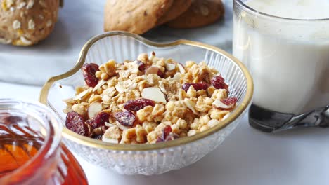 healthy breakfast with granola, milk, and cookies
