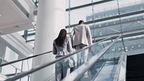 Business-people,-luggage-and-airport-escalator