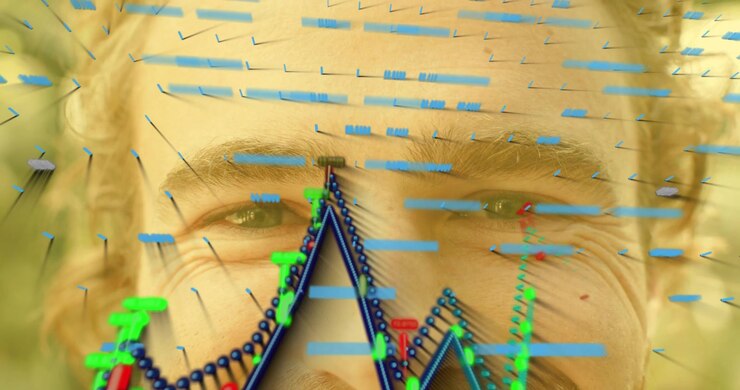 Mid-adult male closing and opening eyes while tech demo tracking facial motion waveform evolving