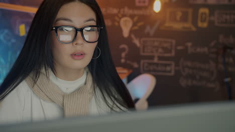 Young Woman Concentrated on Computer Work